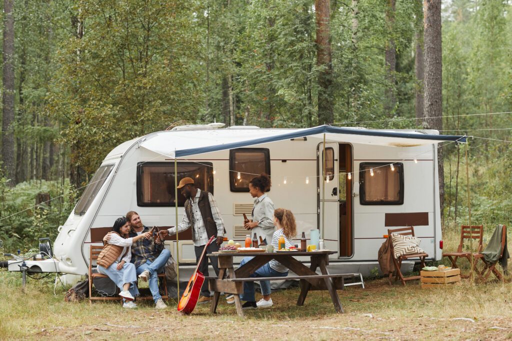 Family enjoying their RV at a campsite. RV storage available at indoor storage units in Delaware, Ohio at Self Storage 42.